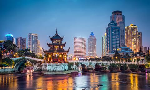 Huangguoshu Waterfall with Skyscrapers and Blue Sky at Dusk