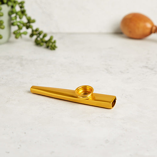 Golden Yellow Metal Kazoo Flute Whistle on White Background