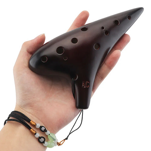 hand holding dorado ocarina 12 hole 