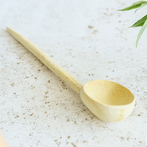 Close-up of handmade large lemon wood spoon ladle, kitchen utensil