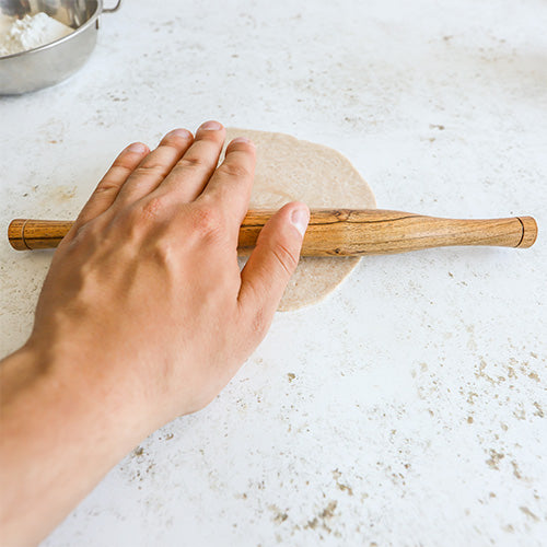 Rolling Out Chapatis with a Traditional Wooden Rolling Pin