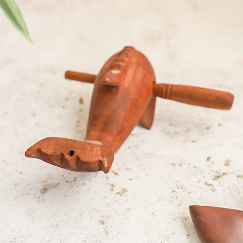 Back View of a Wooden Dolphin Whistle