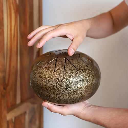 Man playing a handpan drum