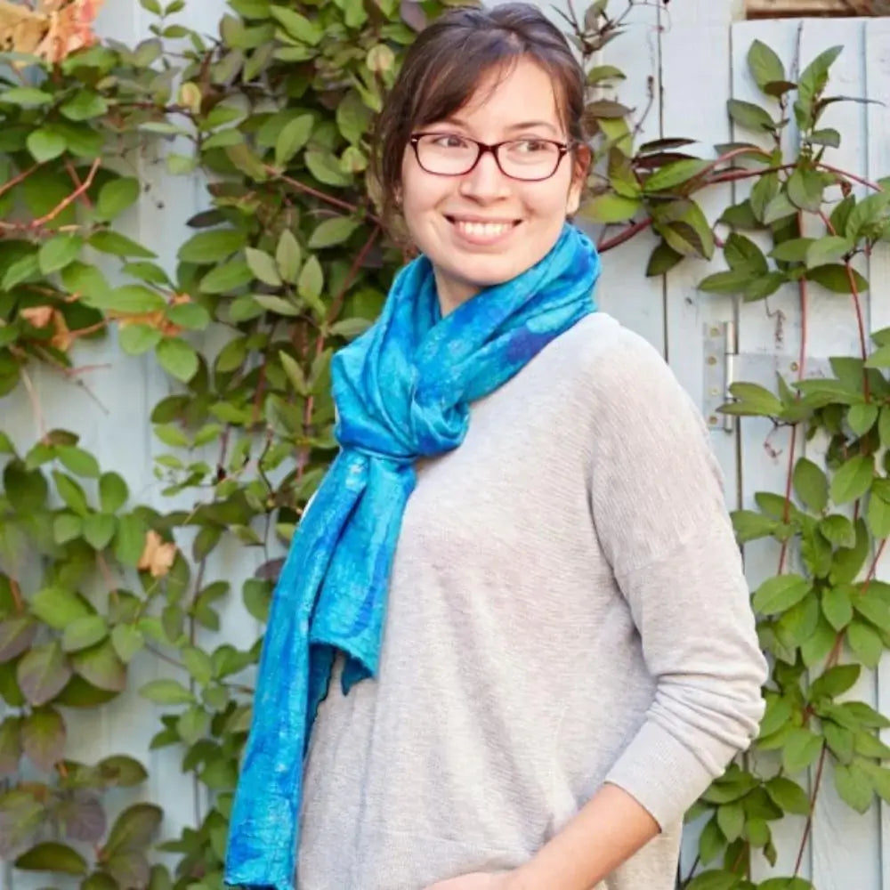 model wearing blue scarf made from silk