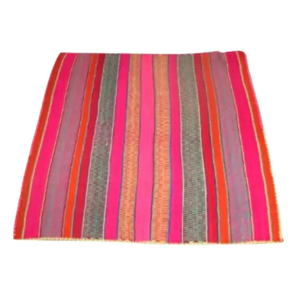 Large square lima rug with pink and red vibrant colors.